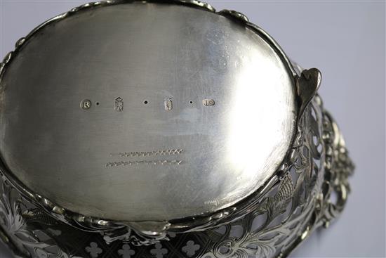 An antique Dutch? pierced silver two handled dish, 15 oz.